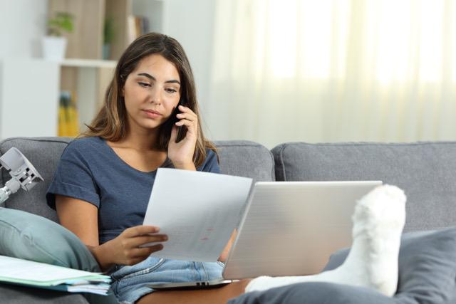 woman looking at paperwork