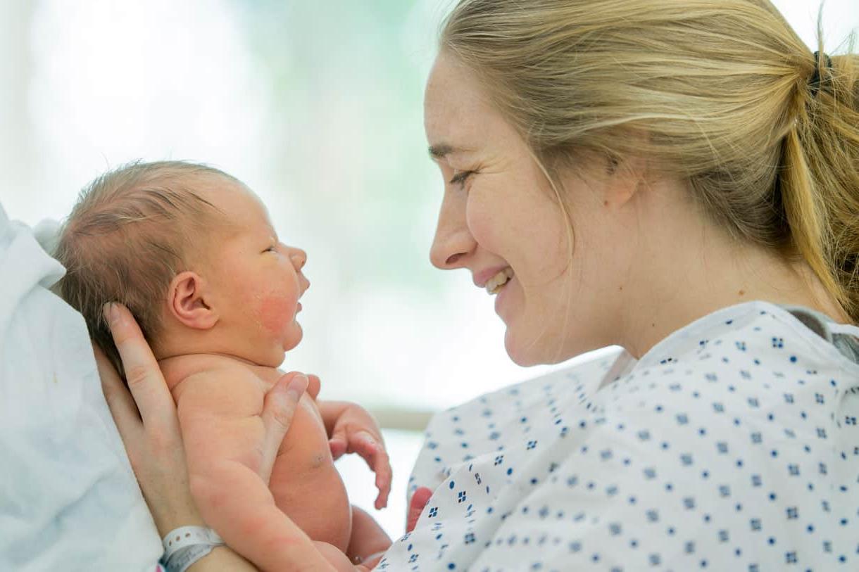 mother holding newborn