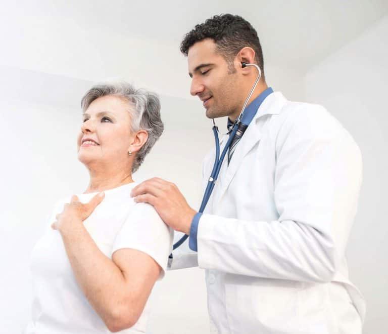 doctor checking patients lungs